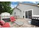 Spacious wooden deck features a grill, comfortable seating, and easy access to the house through sliding glass doors at 12104 Ivanhoe Ct, Brighton, CO 80602