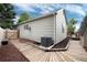 Well-maintained home exterior with a wooden walkway and a clean yard, offering great curb appeal at 12104 Ivanhoe Ct, Brighton, CO 80602