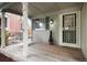 Inviting covered porch with a swing, creating a relaxing outdoor space at the entrance of this home at 12104 Ivanhoe Ct, Brighton, CO 80602