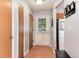 Bright hallway with a back door and access to other rooms in the home at 12104 Ivanhoe Ct, Brighton, CO 80602