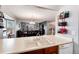 Open-concept kitchen and dining area flow seamlessly into the comfortable living space, great for entertaining at 12104 Ivanhoe Ct, Brighton, CO 80602