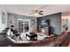View of the living room area leading to an outdoor deck with a sliding glass door at 12104 Ivanhoe Ct, Brighton, CO 80602