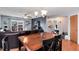 View of the dining and living spaces, with a sliding door leading to an outdoor deck at 12104 Ivanhoe Ct, Brighton, CO 80602