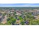 Scenic aerial view showing the neighborhood's layout, homes, and proximity to the city skyline in the distance at 5614 Yarrow St, Arvada, CO 80002
