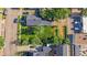 Aerial view of the home and landscaped lot with mature trees at 5614 Yarrow St, Arvada, CO 80002
