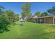 Sprawling backyard features lush lawn and mature shade trees at 5614 Yarrow St, Arvada, CO 80002
