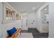 Finished basement area with tile flooring and a rustic bench seat at 5614 Yarrow St, Arvada, CO 80002