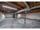Unfinished basement space with exposed ceiling beams and utilities at 5614 Yarrow St, Arvada, CO 80002