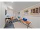 Finished basement area featuring tile flooring and a desk with modern decor at 5614 Yarrow St, Arvada, CO 80002
