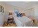 Serene bedroom with natural light, hardwood floors, and comfortable furnishings at 5614 Yarrow St, Arvada, CO 80002