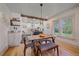 Bright dining area with natural light, stylish table setting, and a view of the modern kitchen at 5614 Yarrow St, Arvada, CO 80002