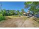 Home exterior featuring large gravel driveway and covered carport at 5614 Yarrow St, Arvada, CO 80002