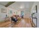 Cozy living area with a leather sofa, decorative pillows, and natural light, creating a comfortable atmosphere at 5614 Yarrow St, Arvada, CO 80002