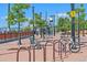 Picturesque town plaza with benches, trees, a water tower, and a bicycle rack for public use at 5614 Yarrow St, Arvada, CO 80002