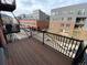 Private balcony overlooking city views and street scene at 2960 Inca St # 319, Denver, CO 80202