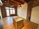 Open living area with hardwood floors and exposed beams at 2960 Inca St # 319, Denver, CO 80202