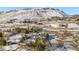 House and property aerial view, snowy landscape at 16587 W 53Rd Way, Golden, CO 80403