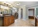 Bathroom features double sinks, granite counters, and a large mirror at 16587 W 53Rd Way, Golden, CO 80403