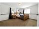 Bright bedroom with wooden bed frame and neutral walls at 16587 W 53Rd Way, Golden, CO 80403