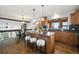 Kitchen boasts an island, granite countertops, and wooden cabinets at 16587 W 53Rd Way, Golden, CO 80403