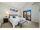 Spacious main bedroom with private deck access and plush bedding at 16587 W 53Rd Way, Golden, CO 80403