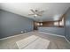 Inviting bedroom features neutral carpeting and lots of natural light, creating a welcoming space at 2404 S Genoa Way, Aurora, CO 80013