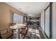 Dining area next to an updated kitchen featuring lots of natural light and sliding door to backyard at 2404 S Genoa Way, Aurora, CO 80013