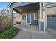 Close up of the porch of a two-story home showing the front door and address at 2404 S Genoa Way, Aurora, CO 80013