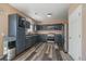 Modern kitchen featuring stainless steel appliances, granite countertops, and ample cabinet space at 2404 S Genoa Way, Aurora, CO 80013