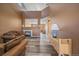 Cozy living room with a fireplace, wood floors, high ceilings and plenty of natural light at 2404 S Genoa Way, Aurora, CO 80013
