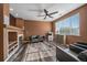 Open living area with a fireplace, recessed lighting, and stylish ceiling fan at 2404 S Genoa Way, Aurora, CO 80013