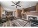 Open concept living area with views to the kitchen, with recessed lighting, and fireplace at 2404 S Genoa Way, Aurora, CO 80013