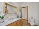 Bathroom features new vanity with marble countertop and decorative wood framed mirror at 4632 14Th St, Boulder, CO 80304