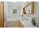 Well-lit bathroom features a subway tile backsplash, new fixtures, and a deep tub at 4632 14Th St, Boulder, CO 80304