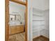 Bathroom with custom shelving seen through doorway at 4632 14Th St, Boulder, CO 80304