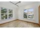 Bright bedroom with large windows showcasing mountain views and light hardwood floors at 4632 14Th St, Boulder, CO 80304