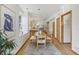 Open dining area with light wood floors, adjacent to a modern kitchen with ample natural light at 4632 14Th St, Boulder, CO 80304