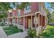 Exterior view of townhomes with covered front porches and manicured lawns at 4632 14Th St, Boulder, CO 80304