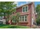 Exterior of the multi-story home with well-maintained lawn and mature tree at 4632 14Th St, Boulder, CO 80304