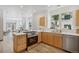 Modern kitchen with stainless steel appliances, a central island, and an open view to the dining area at 4632 14Th St, Boulder, CO 80304