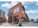 Exterior view of a brick building housing a cafe with large windows and outdoor seating at 4632 14Th St, Boulder, CO 80304