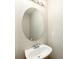 A half bathroom includes a white sink with a mirror, and neutral-colored walls at 9265 Roadrunner St, Highlands Ranch, CO 80129