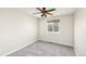 A carpeted bedroom with a window and a ceiling fan at 9265 Roadrunner St, Highlands Ranch, CO 80129
