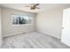 A well-lit bedroom provides carpeted floors and a ceiling fan at 9265 Roadrunner St, Highlands Ranch, CO 80129