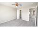 A well-lit bedroom provides carpeted floors and a ceiling fan at 9265 Roadrunner St, Highlands Ranch, CO 80129