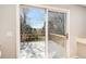 View of the deck overlooking the backyard through sliding glass doors at 9265 Roadrunner St, Highlands Ranch, CO 80129