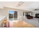 Open living space with hardwood floors, fireplace and sliding glass doors to the deck at 9265 Roadrunner St, Highlands Ranch, CO 80129