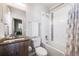 Bathroom featuring white subway tile, a shower/tub combination, and a modern vanity at 2602 W 24Th Ave # 6, Denver, CO 80211