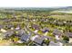 Extensive aerial neighborhood view reveals the community layout and highlights the area's manicured green spaces and tree lined streets at 17378 W 78Th Dr, Arvada, CO 80007