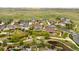 Beautiful aerial view of the property, showing the home's position within a neighborhood with green spaces and walking paths at 17378 W 78Th Dr, Arvada, CO 80007